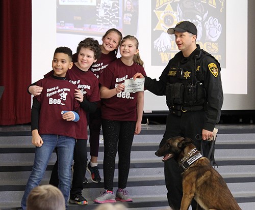 students present check to county officer
