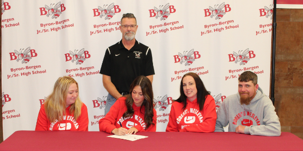 Hagen signs letter of commitment with family and coach 