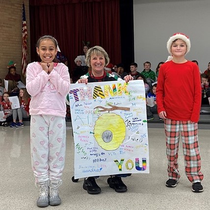 Students present farewell card to Mrs. Stehm