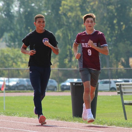 students run in gym class