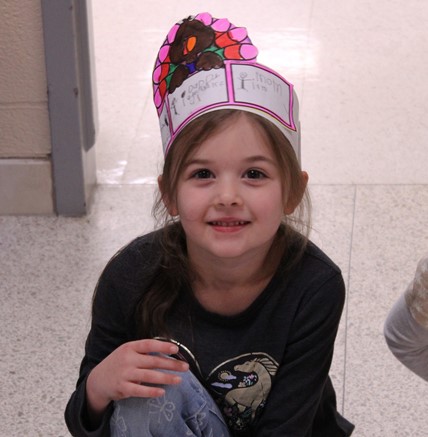 Student with thanksgiving turkey craft hat