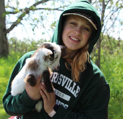 Farm Day participant with goat