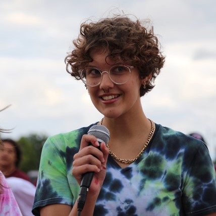 student with microphone