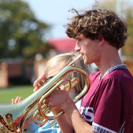 student plays coronet 