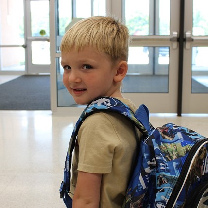 student showing off cool backpack