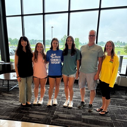 students and staff at local business for community service project