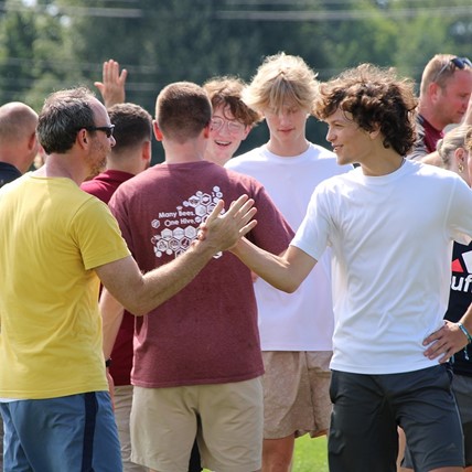high fives after kickball game