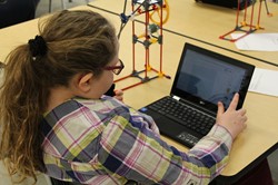 Elementary School student using notebook computer.